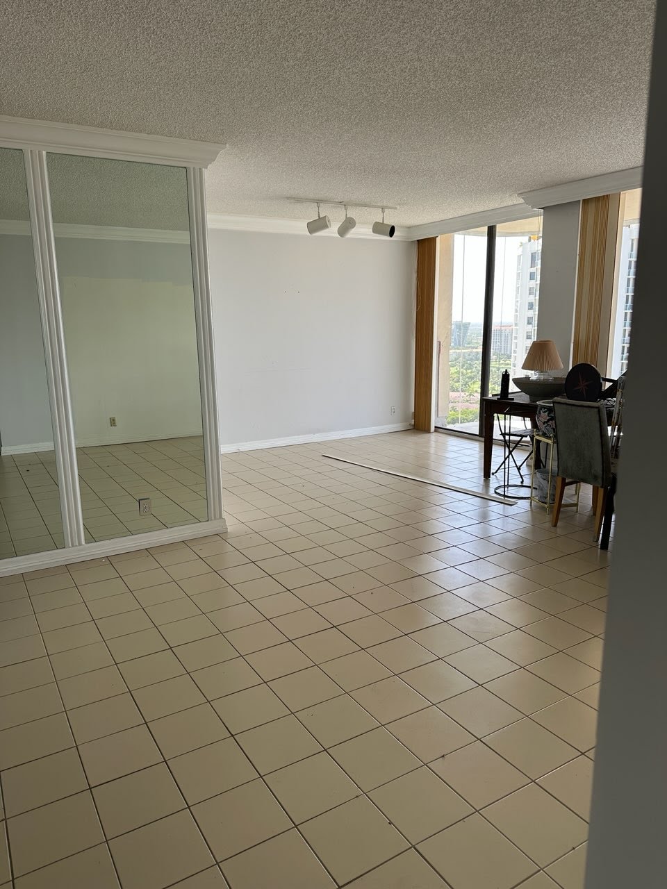 High-rise condo space with items before clearance, showing junk removal in progress