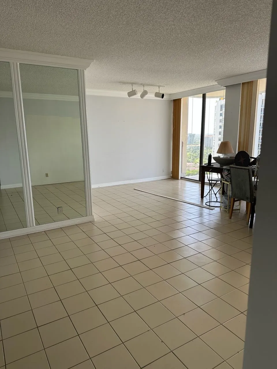 Before: High-rise Miami apartment with furniture and belongings